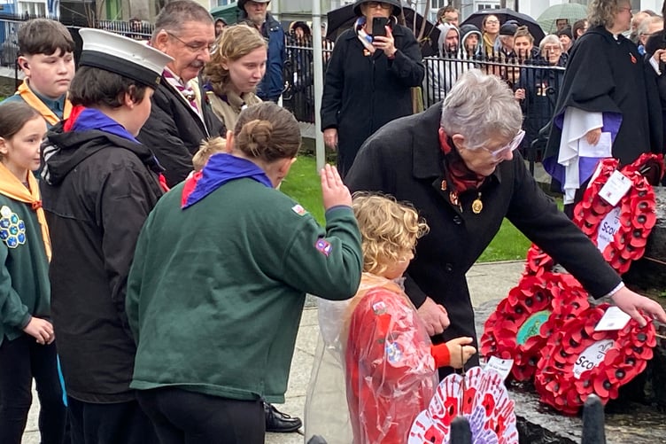 Scouts, Sea Scouts and Girl Guiding representatives laying wreaths at Pembroke Dock