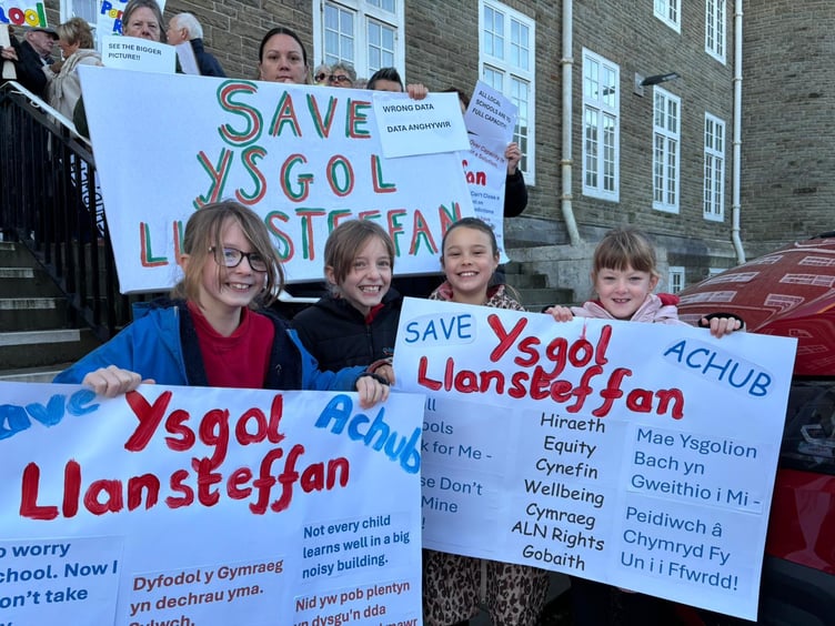 young protesters worried about the future of Ysgol Llansteffan on the steps of County Hall, Carmarthen (pic courtesy of Cymdeithas yr Iaith and free for use for wire partners)