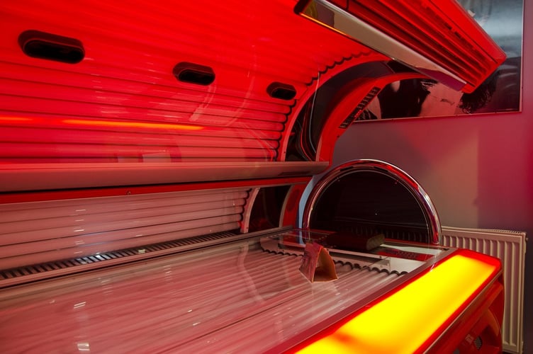 Consumers are urged to verify sunbed salons in Carmarthenshire meet UK safety regulations, including UV output limits.