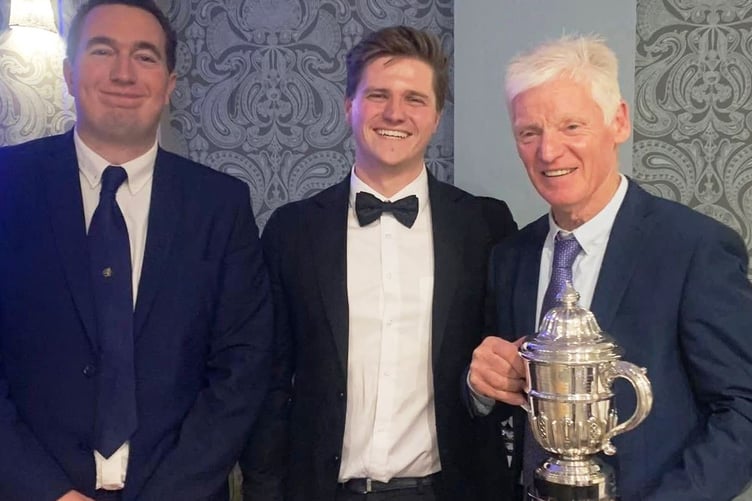 Sailing Captains Tom Eyre and Ben Roberts presenting Robin Wood with the HMS Conway Trophy for the Redwings