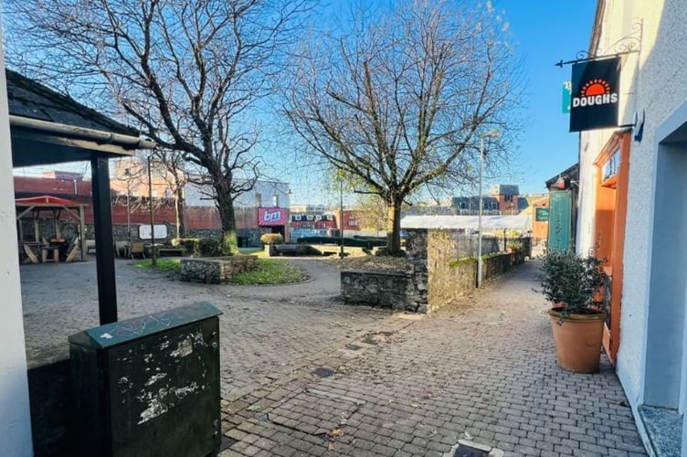 Plans to revamp a square in Carmarthen with new eating areas and landscaping have been approved, promising a significant improvement for the community.