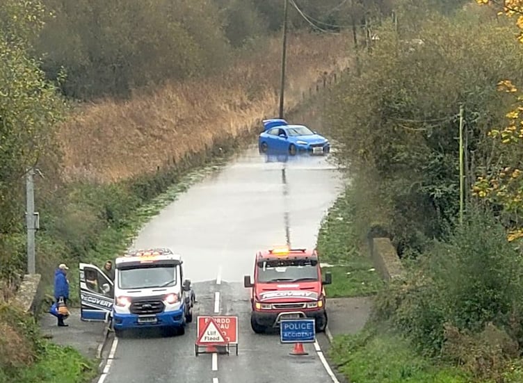 A picture of another car getting stuck in the flood water, shared in the Facebook group 'Gumfreston Flood Updates'