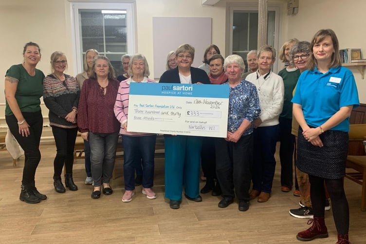 Rosie-Faye Hart, Paul Sartori Foundation, receiving a donation of £333 from Narbelles WI