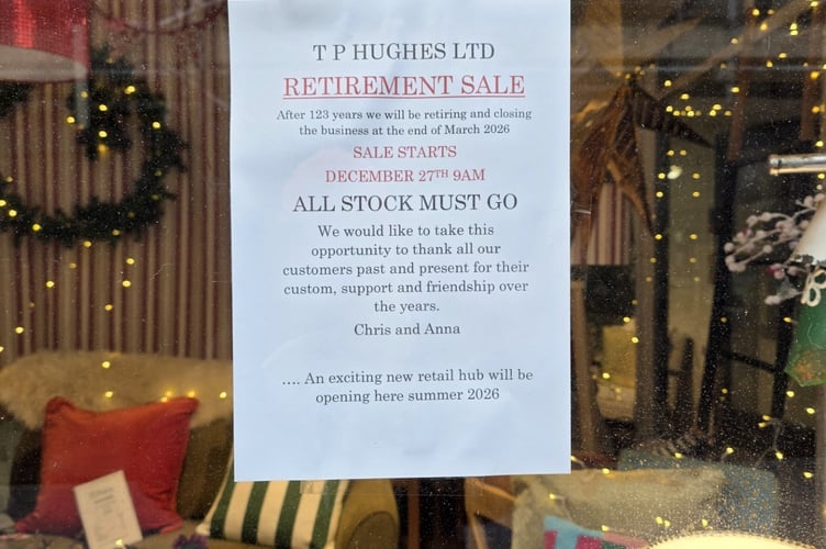 TP Hughes store window