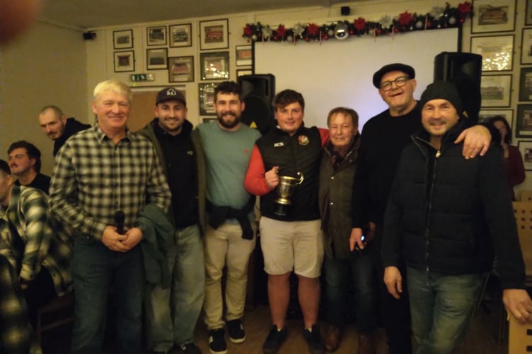 Gibby family present cup to club captain Lloyd Davies with club President and Chair present