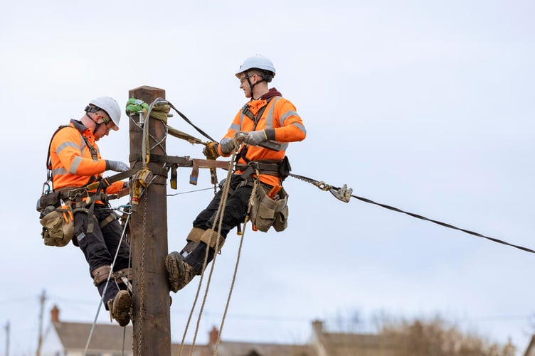 National Grid workmen maintaining electricity pole