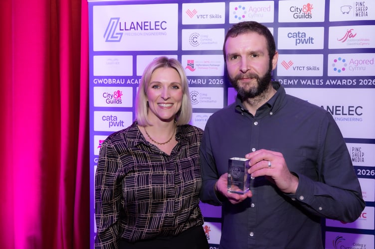 Bus driver apprentice award winner Dean Turner with Frances Lee from event sponsors Agored Cymru. 