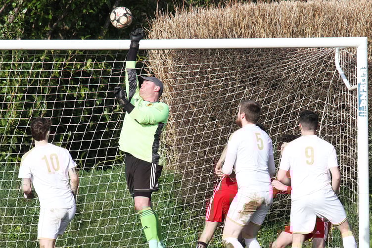 Carew keeper Tom Davies makes one of many great saves against Goodwick