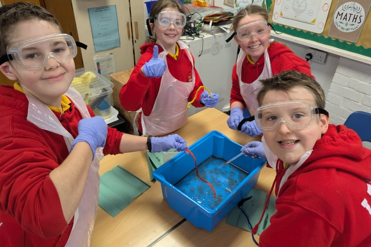 Lamphey pupils cleaning up an oil spill