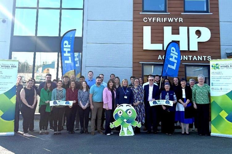 The LHP team come together to celebrate their Charity of the Year