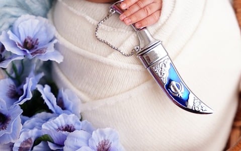 The kirpan is a mandatory article of faith worn by initiated (Amritdhari) Khalsa Sikhs