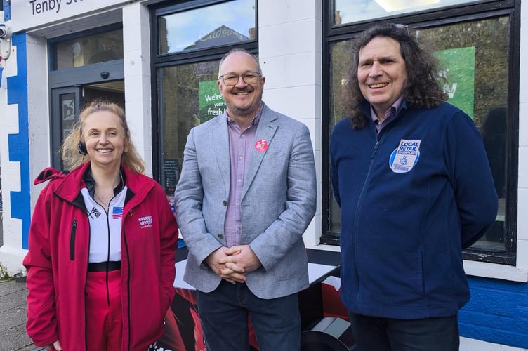 Fiona and Vince Malone, owners of Tenby Stores and Post Office, with Cllr Marc Tierney.
