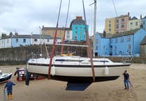 Tenby harbour lift‑in signals start of sailing season