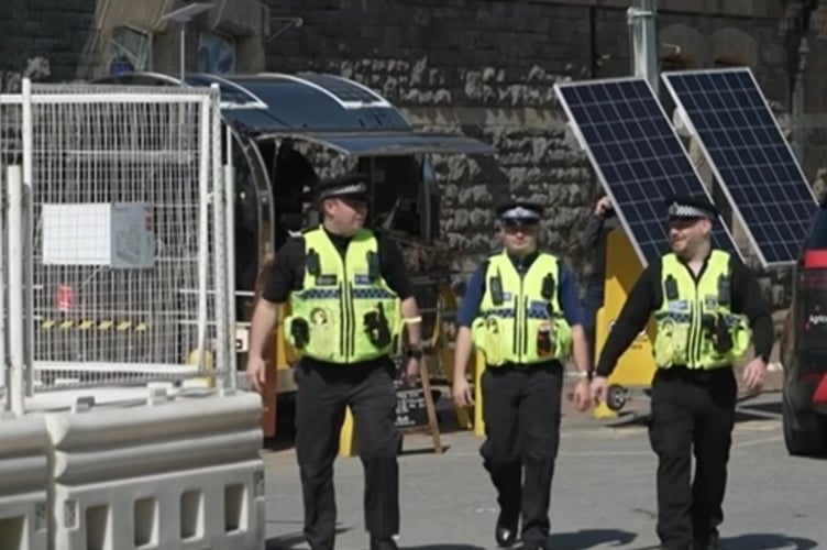 Police officers at Tenby Railway Station on the day after the stabbing incident.