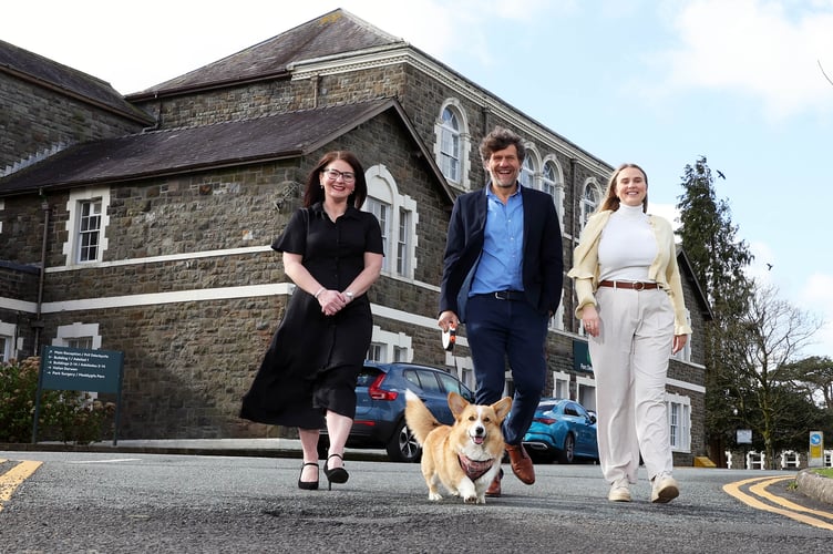 Clare Sullivan, Mark Andrews (with corgi Winnie), and Izzy Andrew at Parc Dewi Sant.