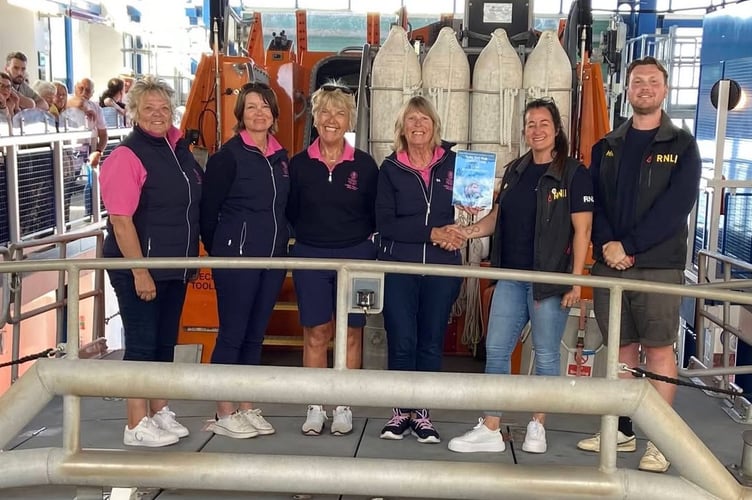 Tenby Golf Club members, including Sarah Waring, supporting the RNLI, with more than £2,100 raised through ladies’ section fundraising efforts. 
