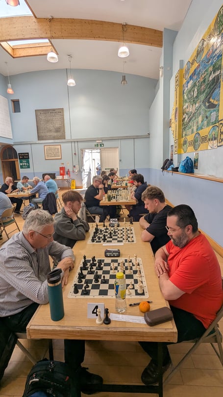 Chairman of Narberth Chess Club Michael Edwards (in red) competing at the tournament