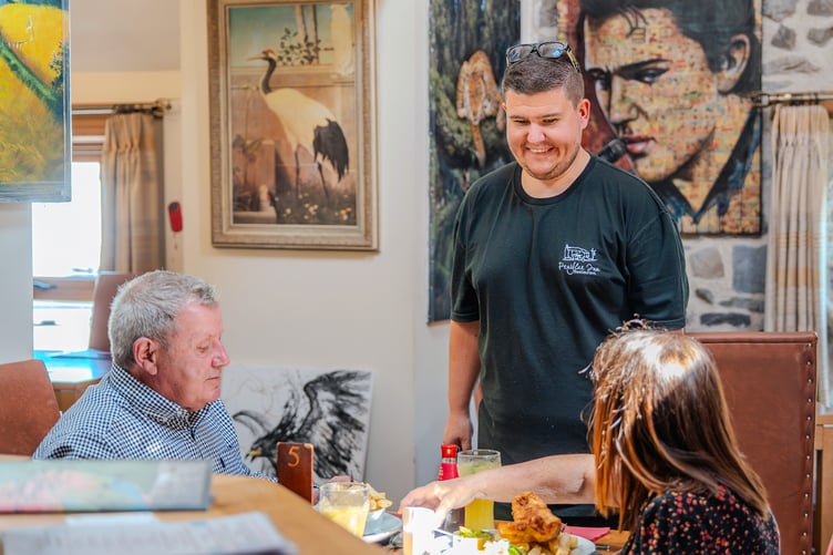 Aaron Jones with customers