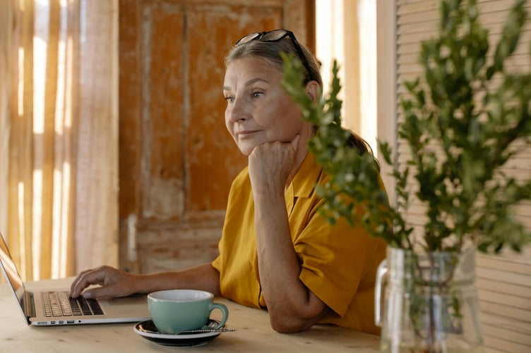Older woman using laptop