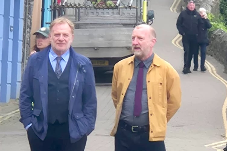Mark Lewis Jones and Steffan Rhodri lead the cast, pictured here filming on Crackwell Street in Tenby.