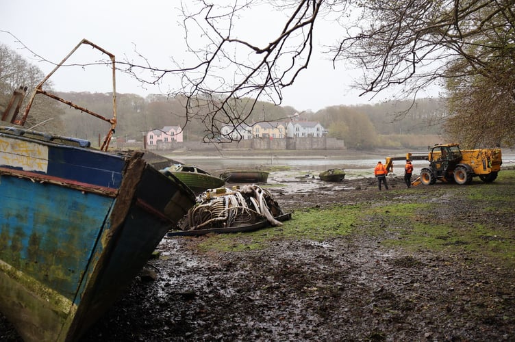 Contractors (Dale Sailing) removing the derelict vessels and other items that had been fly-tipped into Castle Pill.
