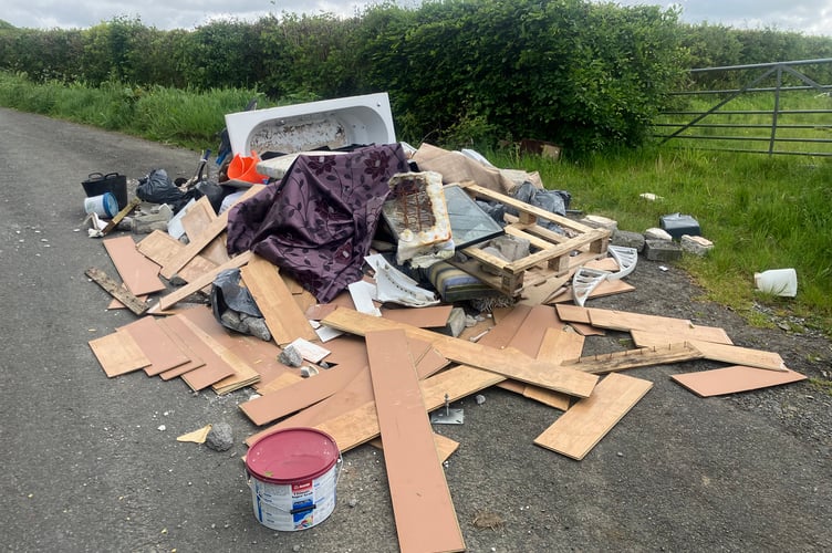 A significant amount of waste was dumped on a stretch of countryside road alongside the gate of a farm field, nearby Nantycaws,