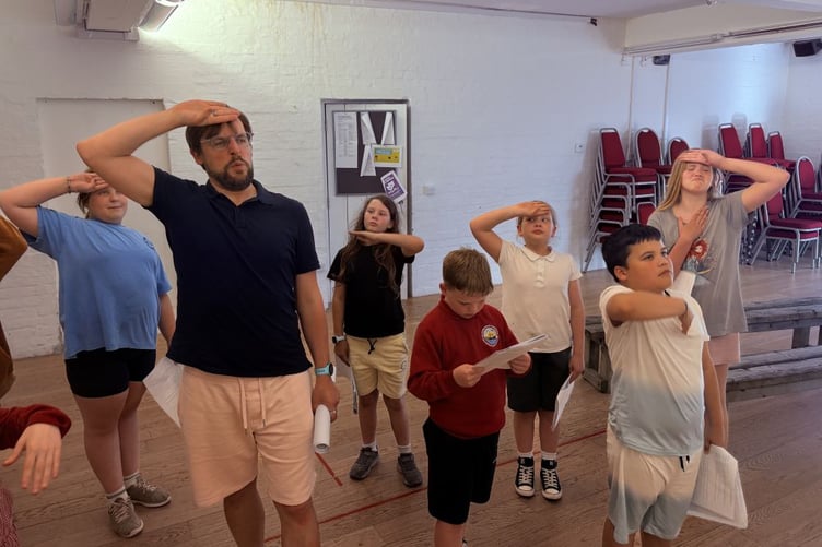 Tim Howe with Torch Youth Theatre members