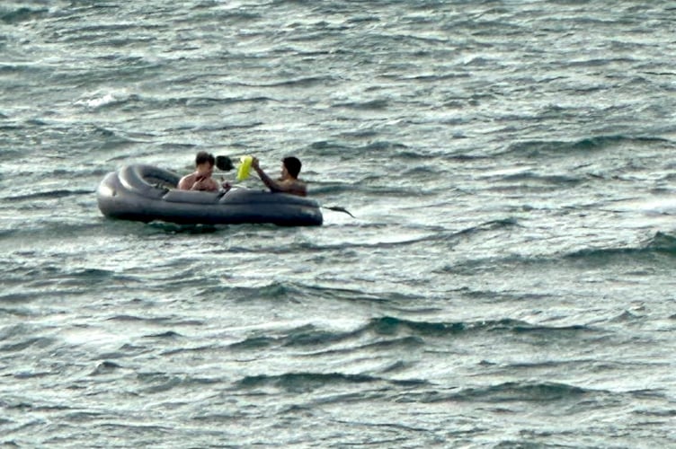 Two men on a deflating dinghy near Pendine were rescued by Tenby RNLI