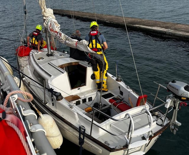 RNLI rescue yacht and kayaker in St Davids
