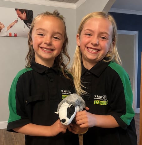 Caption: Menna and Bronwen Laurence-Elias put the first aid skills they’d learned as St John Ambulance Cymru Badgers into action to help their grandad, who had cut his head after falling at home.