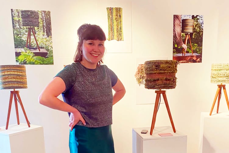 Kitty with some of her work.