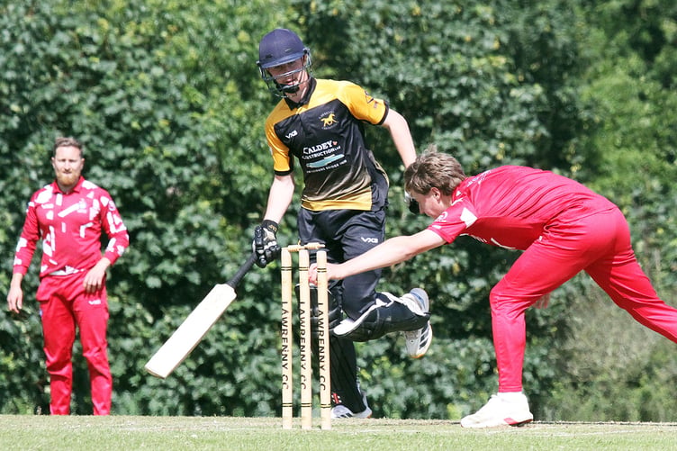 Lawrenny batsman is run out as the bail is lifted off the stumps