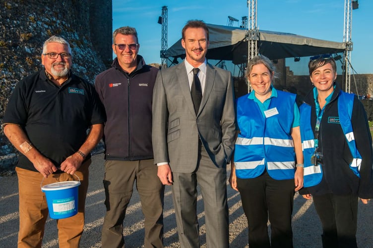 Jon Williams from Pembroke Castle with Laura Hugman, CEO at The Paul Sartori Foundation and other team members with headline act Russell Watson.