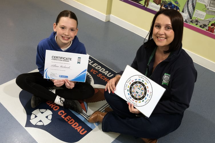Caption: Competition winner Lillian is pictured with Council Road Safety Office Sally Jones.