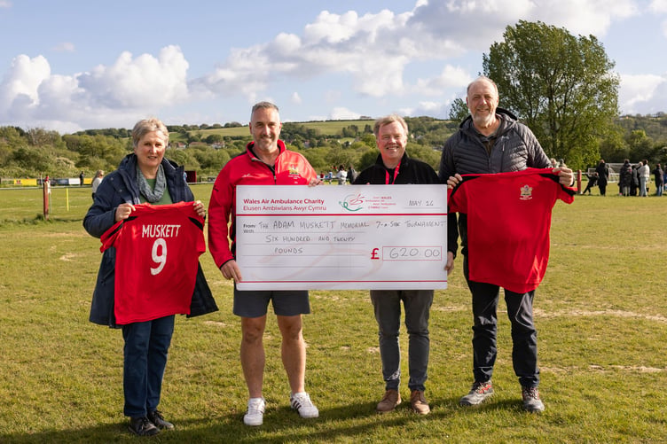 Adam’s mum Helen Muskett; Gareth Noot, Tenby AFC Secretary; Mike May, Wales Air Ambulance Regional Fundraising Manager; and Andrew Muskett, Adam’s father during the cheque presentation.