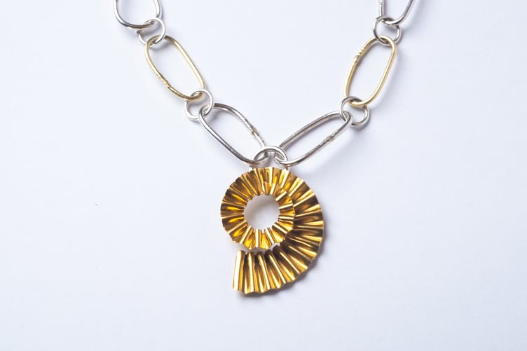 Gold and silver ammonite necklace by Suzie Horan