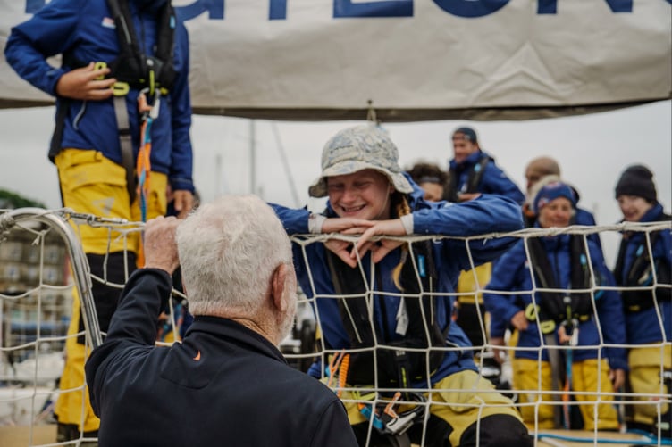 Team Tongyeong skipper Lou Boorman is congratulated by Clipper Race chairman and co-founder Sir Robin Knox-Johnston