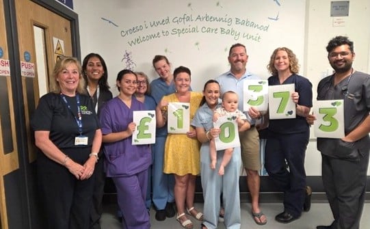Pictured above: Staff from the unit with Alyson Powell, Lucy Powell, Chester and Nigel Powell.