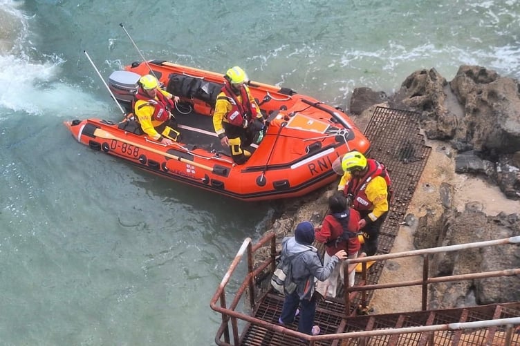 Two people were rescued by Tenby RNLI's inshore lifeboat after being cut off by the tide below the Atlantic Hotel.