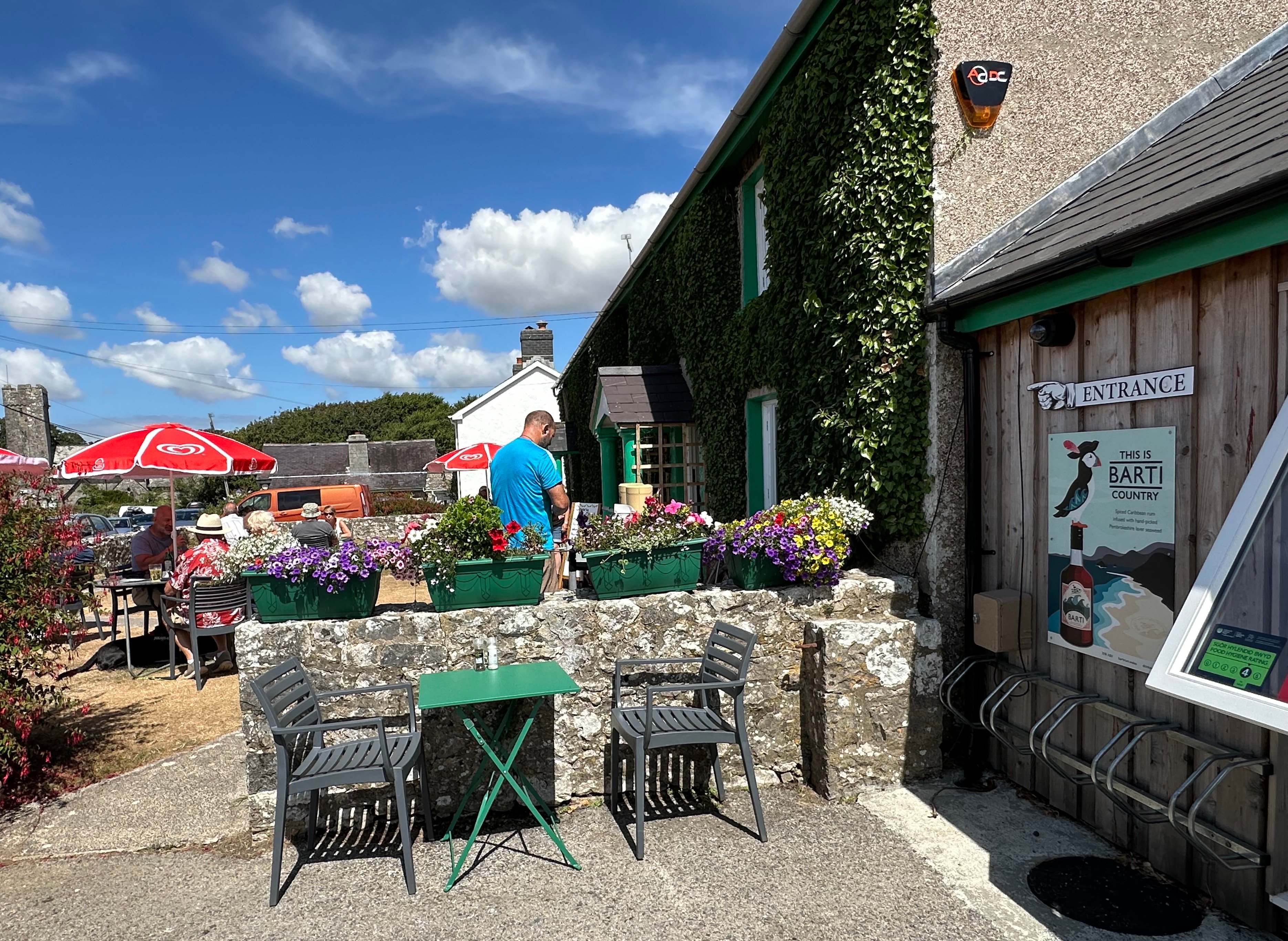 Bosherston Bistro - hygiene rating, Barti Rum, parasols, flowers, church