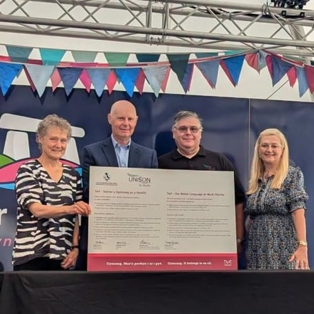 Pictured at the signing event, from left to right, are Dr Madeleine Havard, Chair of Pembrokeshire Coast National Park Authority; Tegryn Jones, Chief Executive of Pembrokeshire Coast National Park Authority; Jonathan Lewis, Secretary of UNISON Pembrokeshire; and Dr Mandy James, TUC Cymru Bilingual Communications Officer.