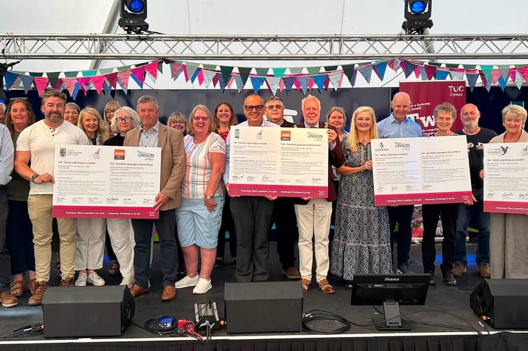 Pembrokeshire County Council and Pembrokeshire Coast National Park Authority commit to promoting Welsh language at work.
