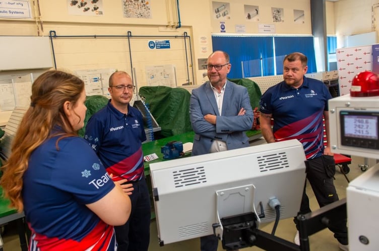 The Deputy Minister for Skills and Tertiary Education, and Senedd Member for Sir Gaerfyrddin, Cefin Campbell, visited the camp to see the training in action and speak with Madeleine and other apprentices taking part.