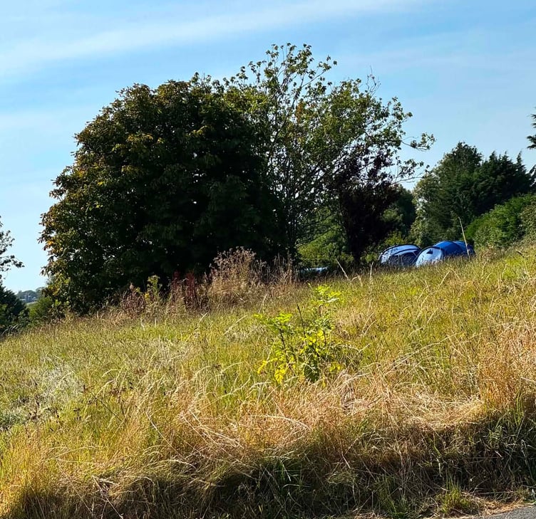 A Pembrokeshire County Councillor has bemoaned the lack of a police response to an incident where private land between New Hedges and Tenby was invaded by a group of travellers for four days