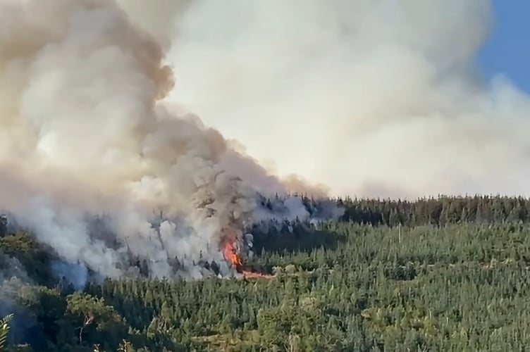 A major incident has been declared due to a wildfire in Carmarthenshire, with evacuations underway as firefighters work to contain the blaze.