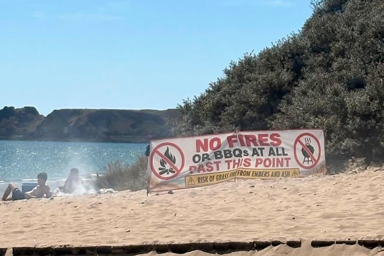 Advice for 'No fires' - clearly being ignored on Tenby's South Beach this week