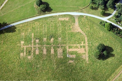 Aerial image show parch marks at Dinefwr revealing the remains of former Nissen huts