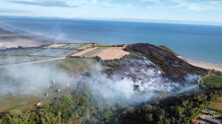 Firefighters and locals continue to tackle the Pendine wildfire after it reignited, prompting action from Pendine Community Council.
