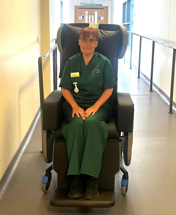 Health Care Support Worker Delyth Charles-Davies in one of the new chairs