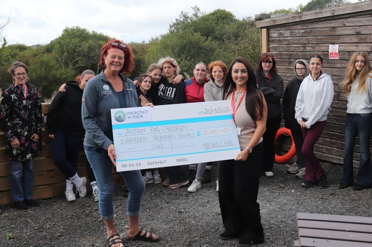 Helen Heaton and Christina Williams with staff and young people supported by Action for Children